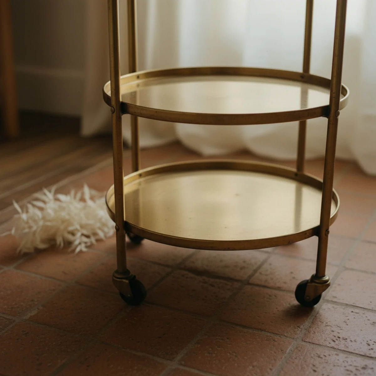 Bar cart styling — vintage 1970s brass rolling bar cart with lower and upper tiers showing warm aged brass patina as the composition's warm foundation — Home Decor Aura