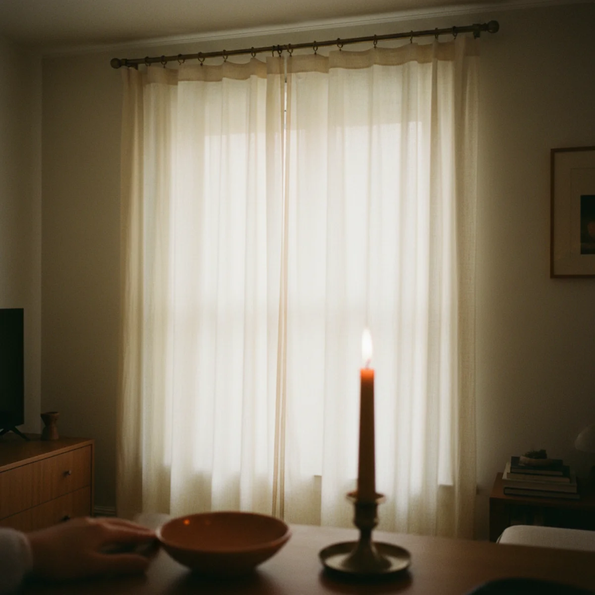 Small apartment decorating ideas — linen curtain panels hung from rod mounted 4 inches below ceiling and extending 8 inches beyond window in a warm small apartment — Home Decor Aura