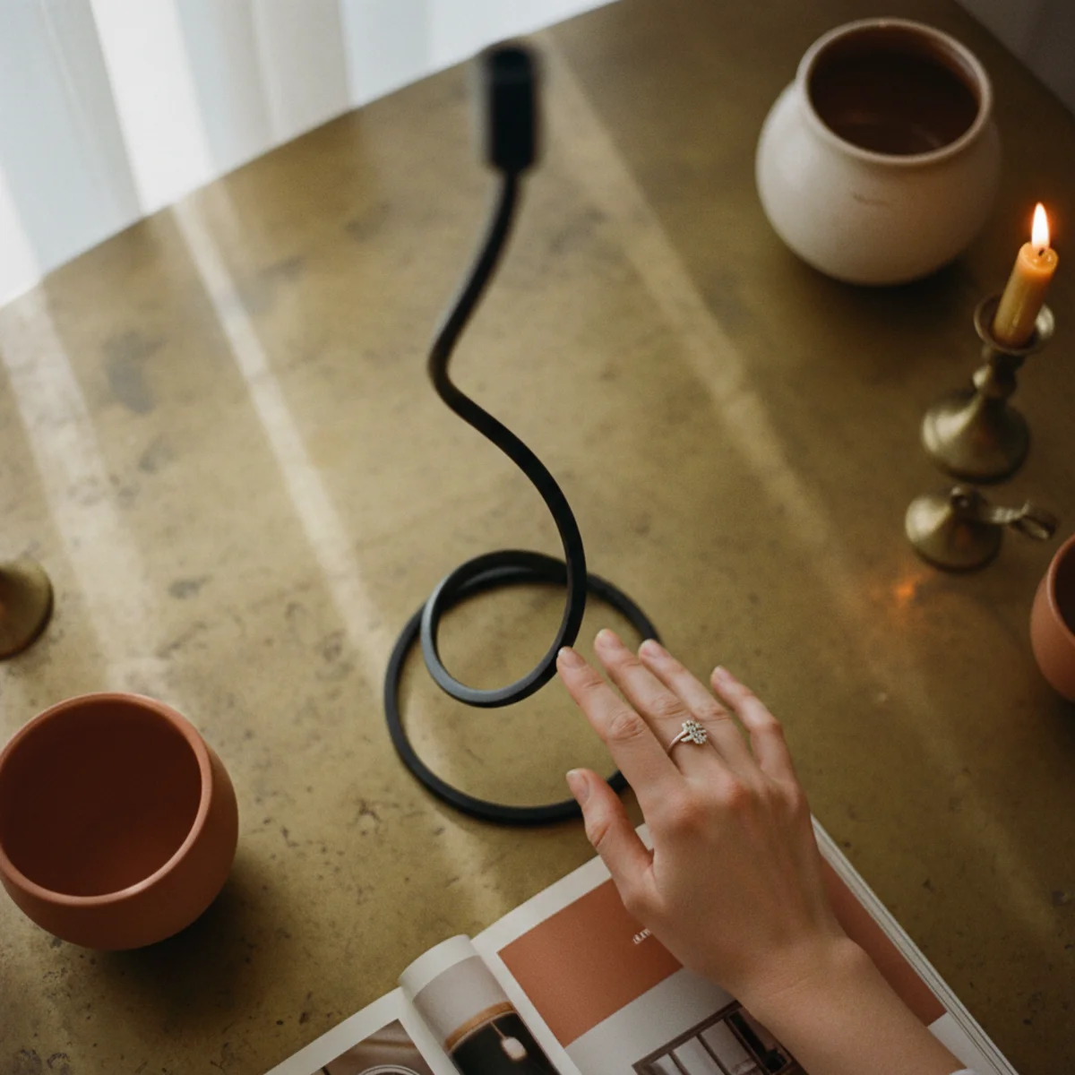 Japandi style — Japandi room with single black-framed photograph, soft matte black ceramic vessel, and oiled bronze hardware providing 5% black contrast against warm neutral palette in a warm Japandi interior — Home Decor Aura